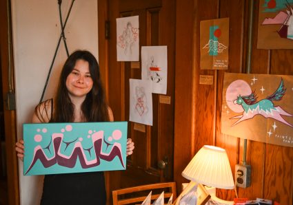 Painter holding painting at the Sou'Wester Artist Residency